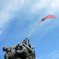 military statue holding flag