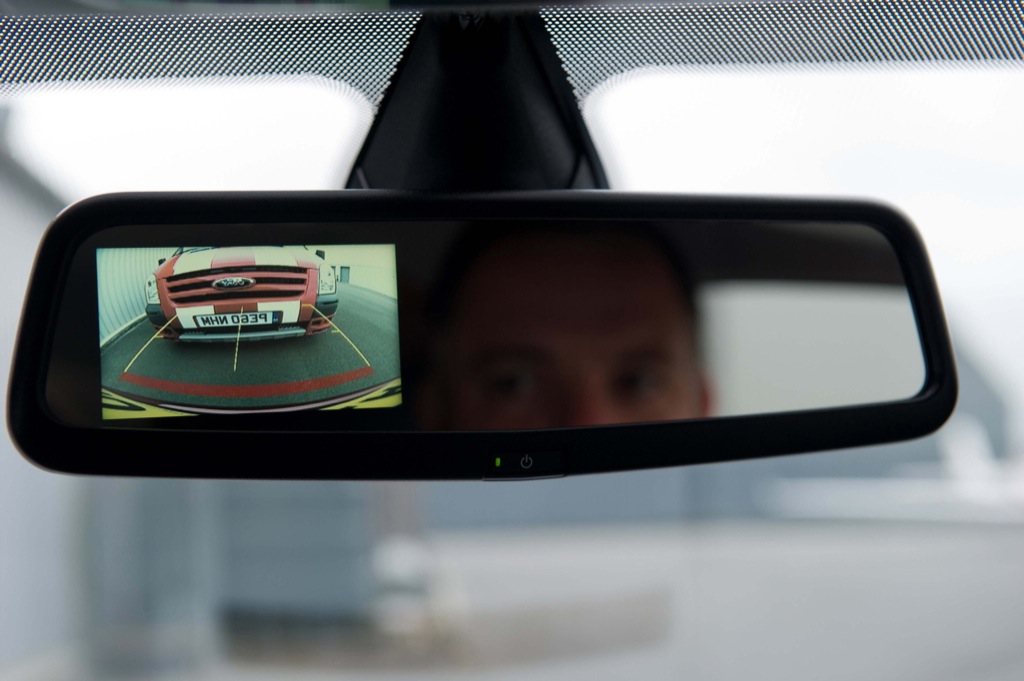 Back up camera view displayed inside the rear view mirror