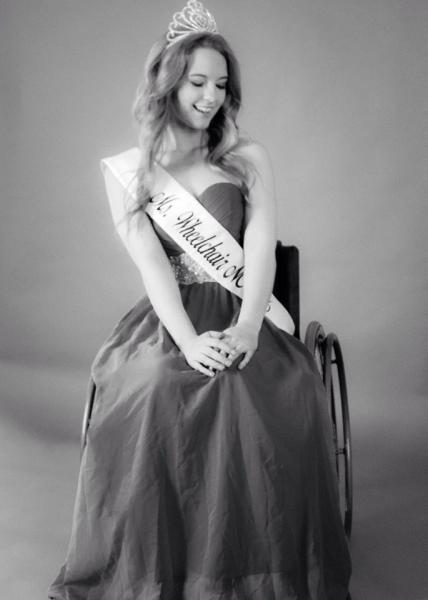 Madeline Delp, Miss Wheelchair NC USA 2017 posing in her wheel chair.