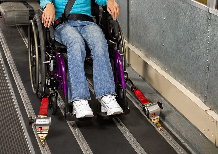 girl with pink sweater in wheelchair